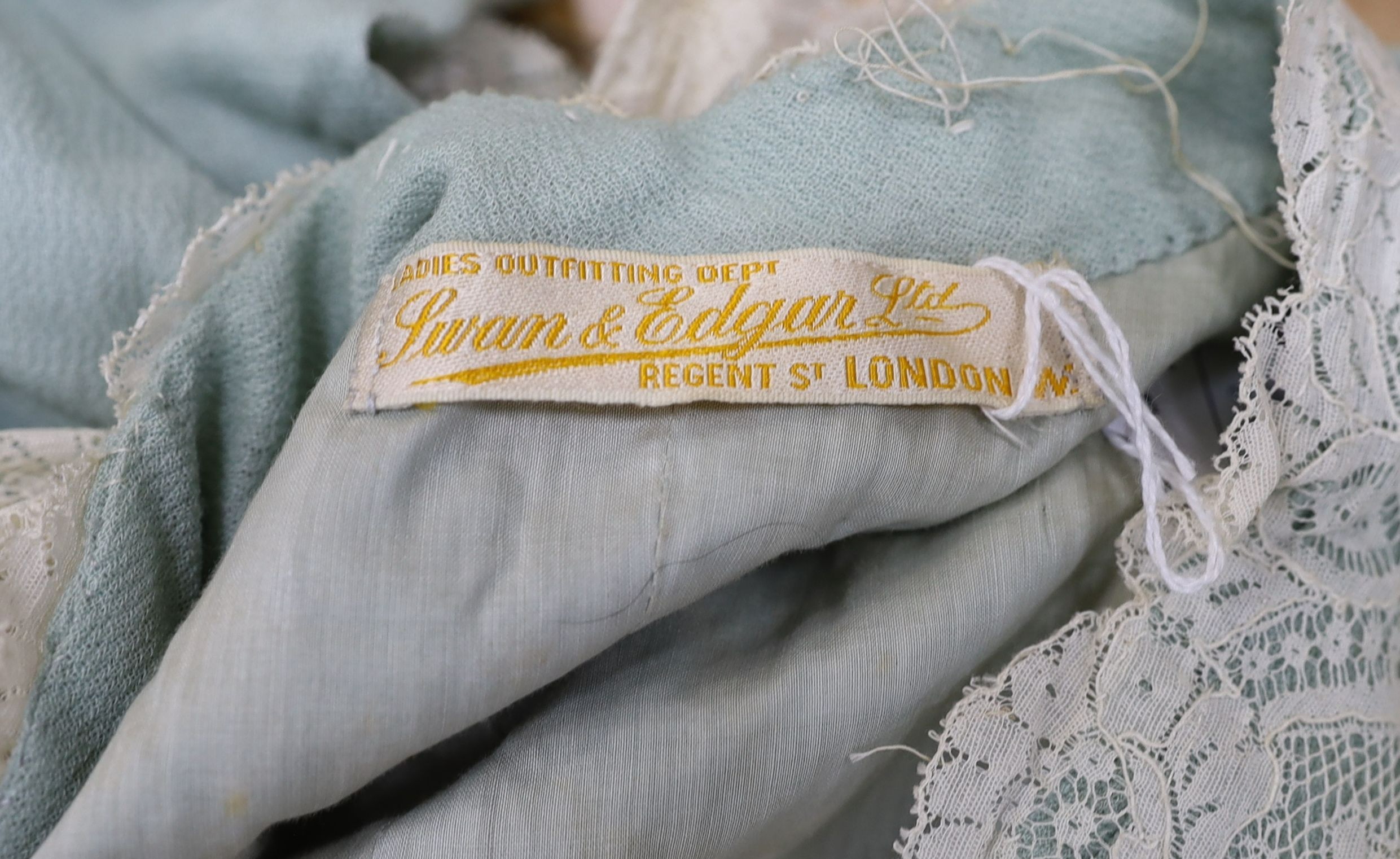 An Edwardian turquoise crepe and cream lace summer coat with original Swan & Edgar Ltd label